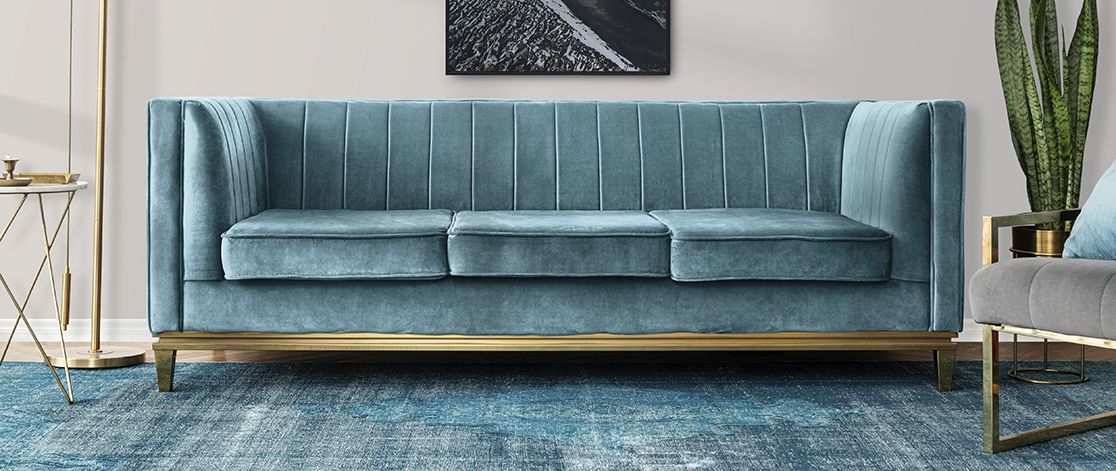 Blue couch and other furniture in a showroom setting