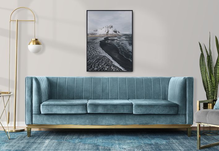 Blue couch and other furniture in a showroom setting