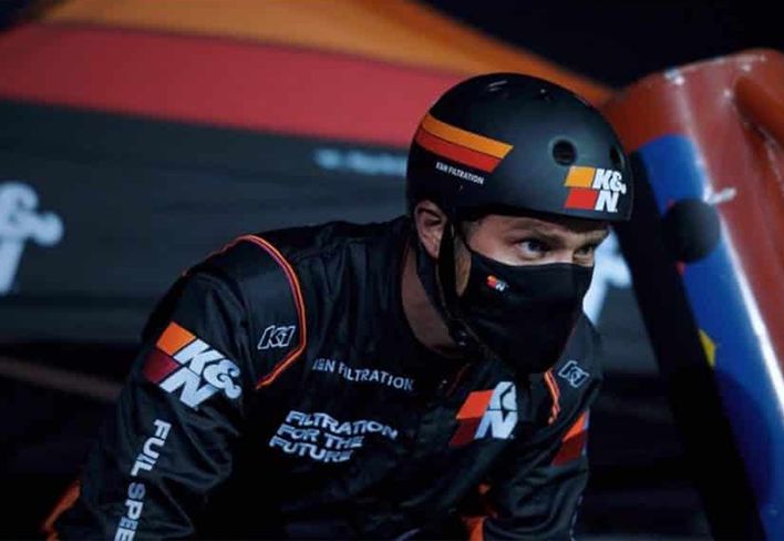 Motor Bike Racer at the starting line with a helmet about to race